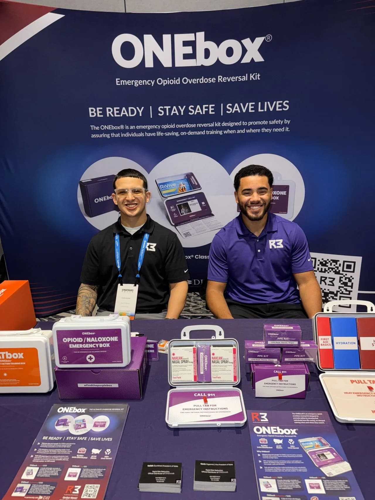 R3 team members at the ONEbox conference booth